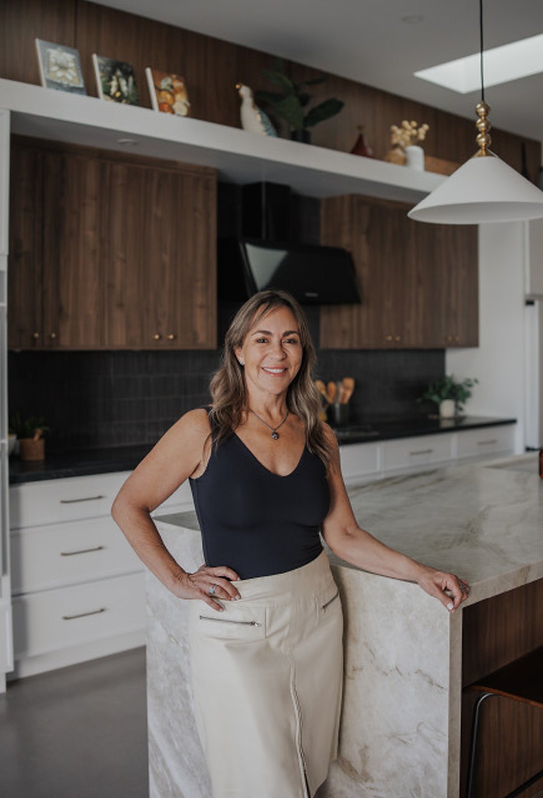 Tomi Emptage, Real Estate Broker, at a Phoenix kitchen island