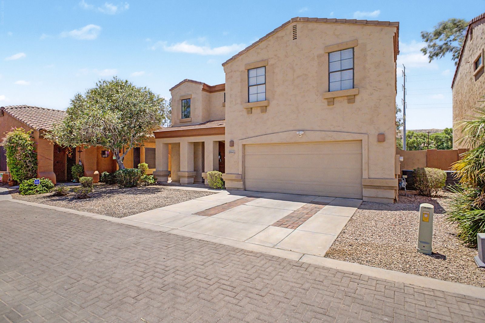 Street view of the home and driveway
