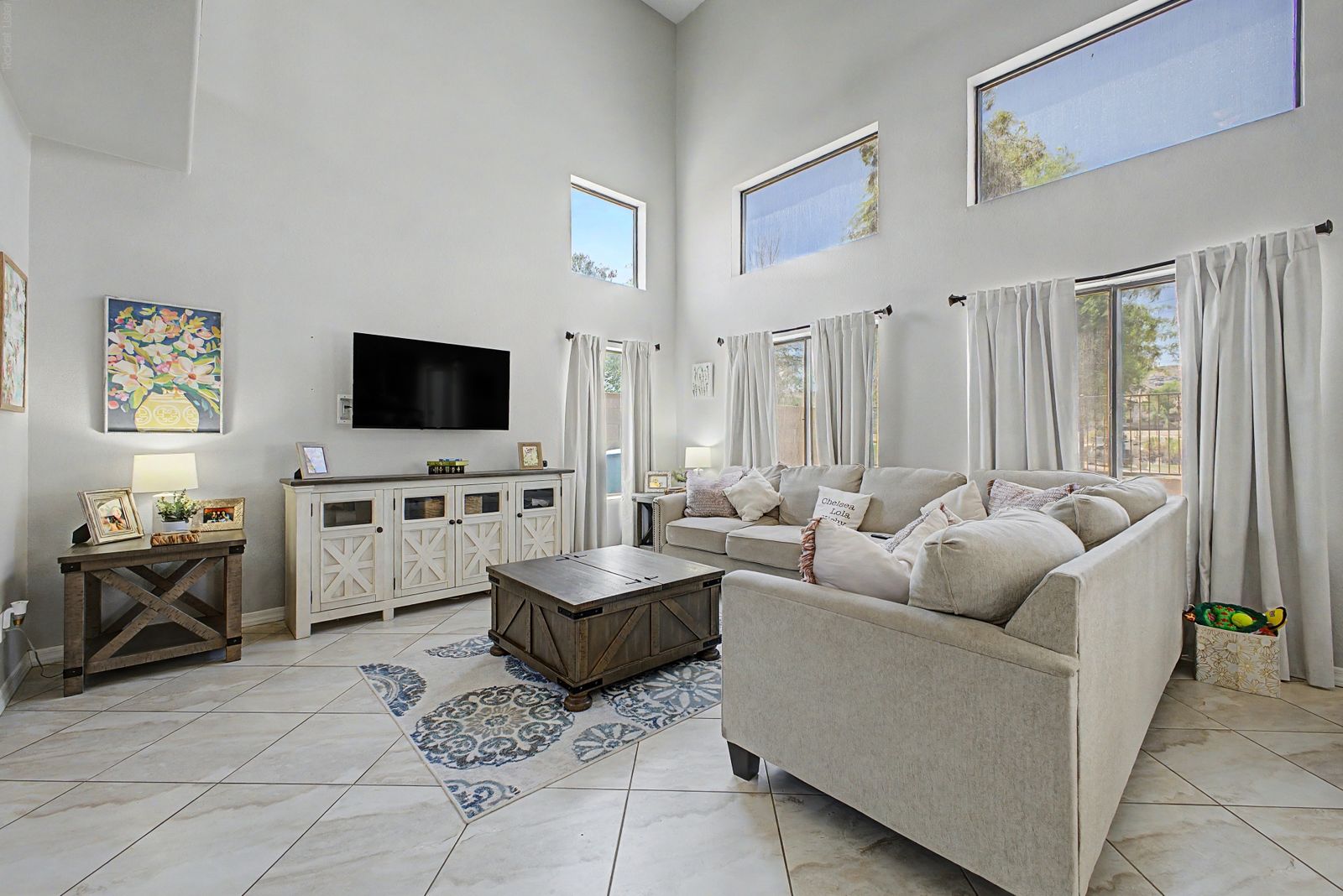 Living room with clerestory windows and tile floors