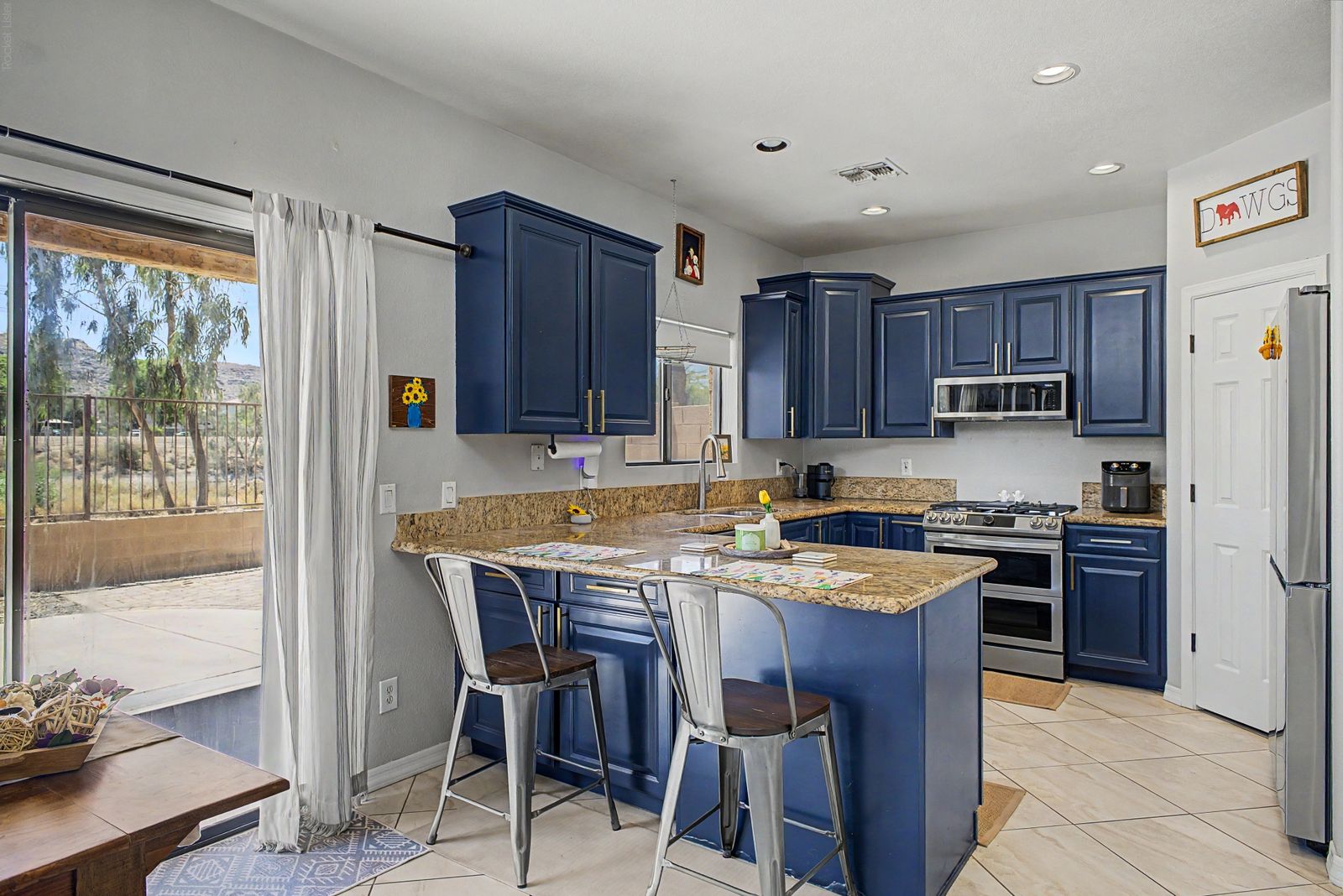 Kitchen breakfast bar beside the patio slider